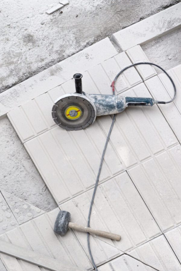 Construction tools on sidewalk under repair. Construction background