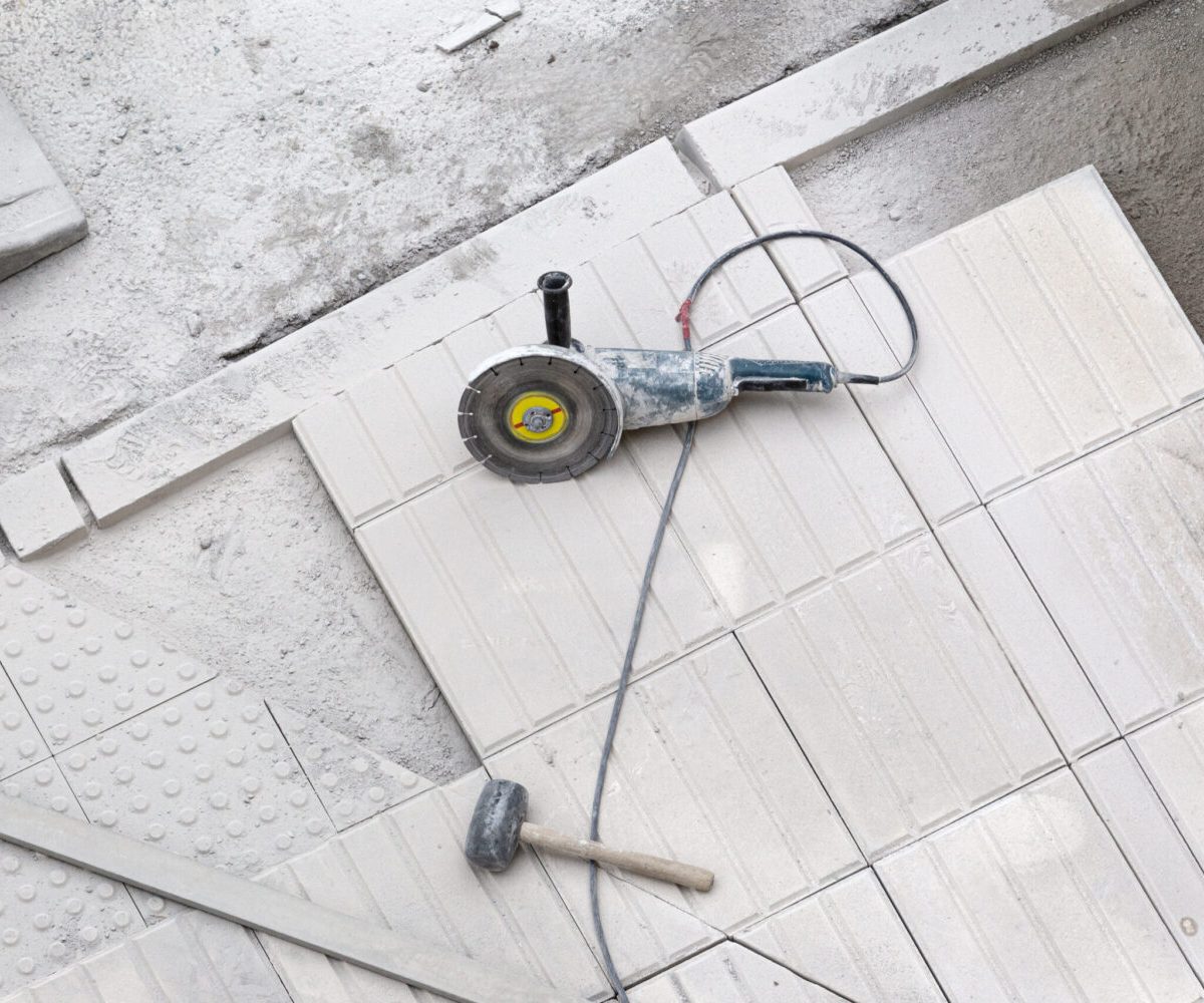 Construction tools on sidewalk under repair. Construction background