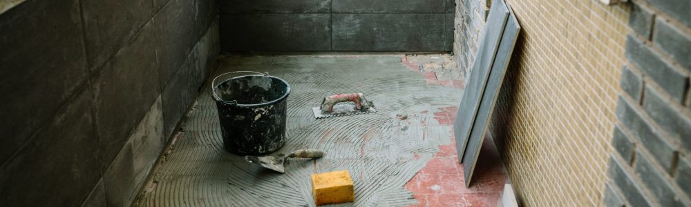 Tile laying work on glazed terrace floor