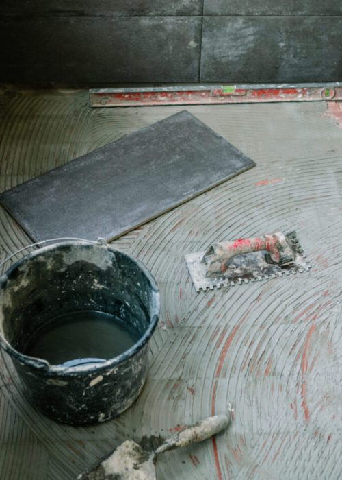 Tile laying work on glazed terrace floor